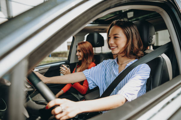 istock Female driver driving ride-sharing taxi 1159573858