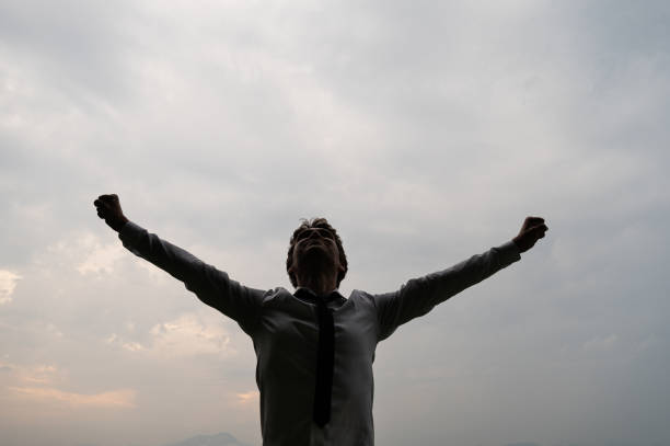 istock Businessman standing with his arms spread widely 1159576508