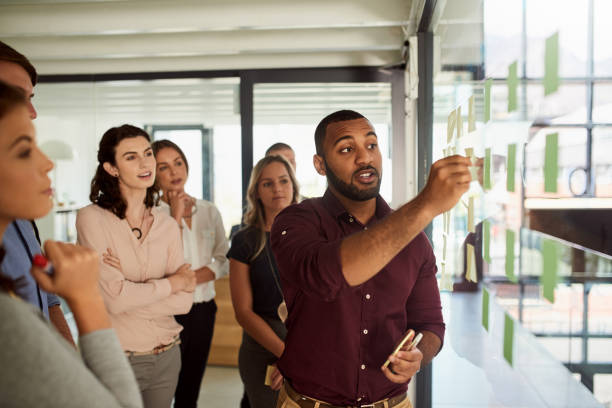 istock Directing his team along his plan for success 1159576526