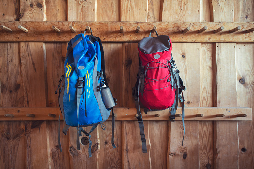 Females and males backpack hanging