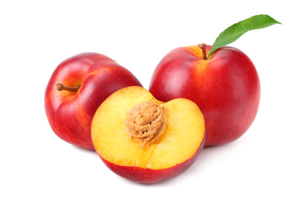 istock Nectarine with green leaf and slices isolated on white background 1159580048
