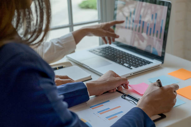 istock Business team brainstorming and discussing with financial data and report graph. Teamwork meeting working concept. 1159581762