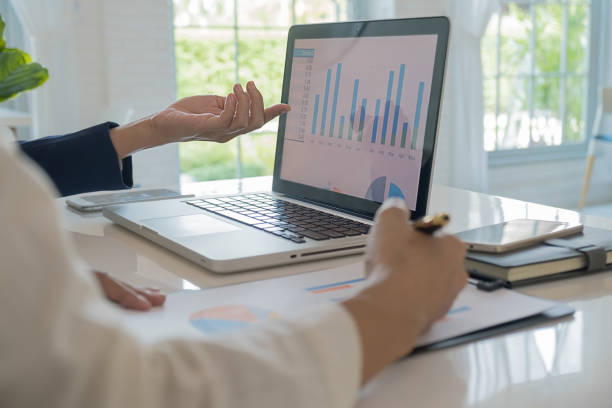 istock Business team brainstorming and discussing with financial data and report graph. Teamwork meeting working concept. 1159581895