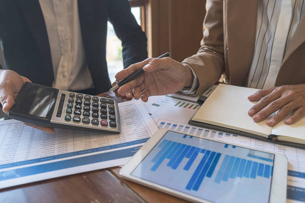 istock Business team brainstorming and discussing with financial data and report graph. Teamwork meeting working concept. 1159581910