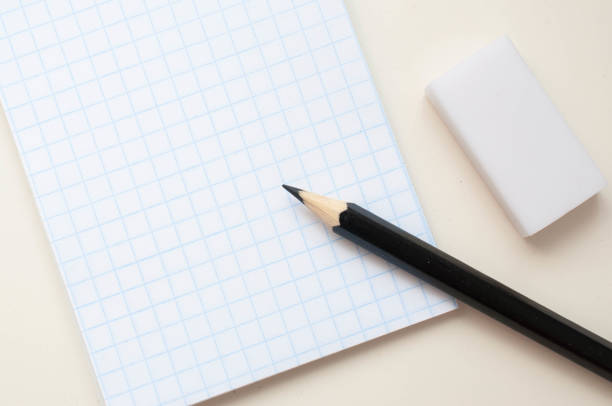 istock Notebook with a place for an inscription and a black pencil on a neutral background 1159582622