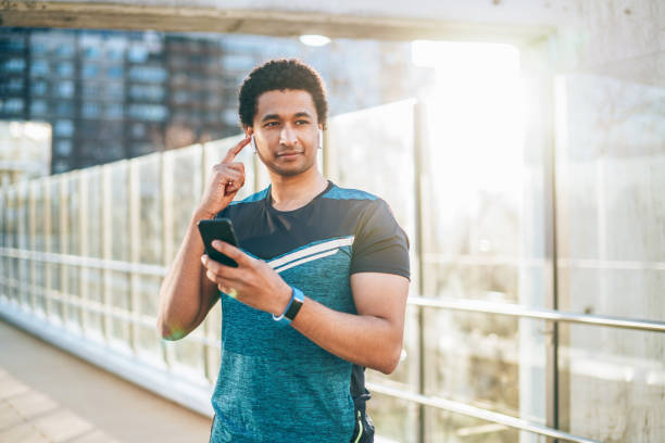 istock Young athlete with smart phone 1159582926