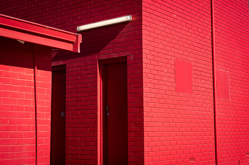 painted red brick wall and door