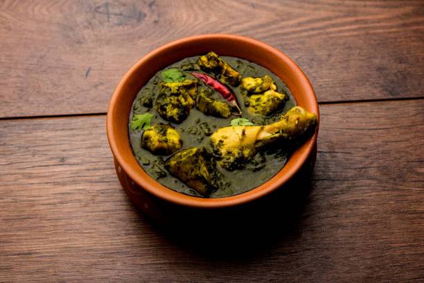 istock palak/spinach Chicken or Murg Saagwala served in a bowl with Naan and rice 1159585443