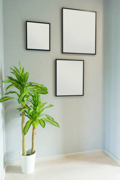 istock Many blank picture frame hanging on wall at home. 1159585783