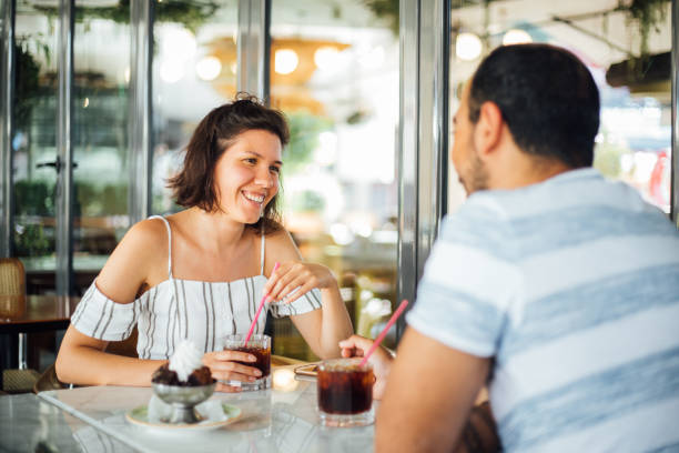 istock Couple of young people drinking coffee 1159586664