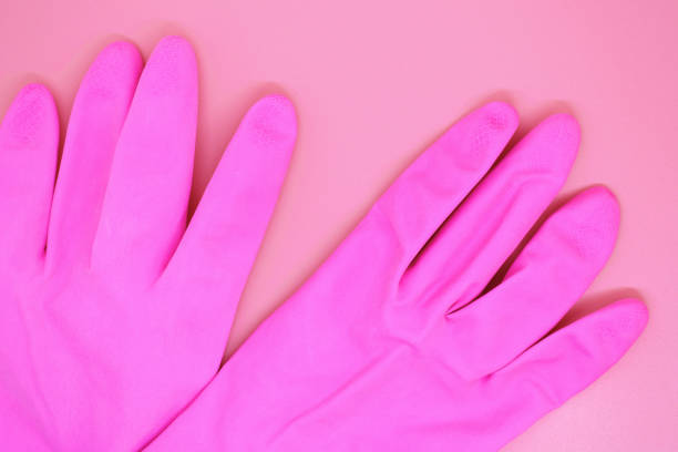 istock pink gloves close-up on pink background, 1159586874