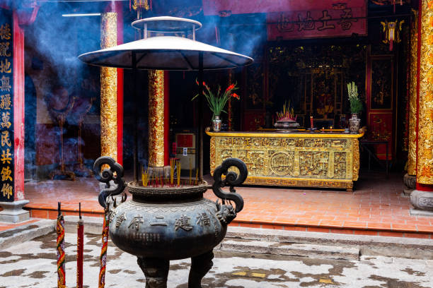 Incense sticks in large vase in Ong Bon Pagoda (Nhi Phu Mieu), Cho Lon Ho Chi Minh City, Vietnam. stock photo