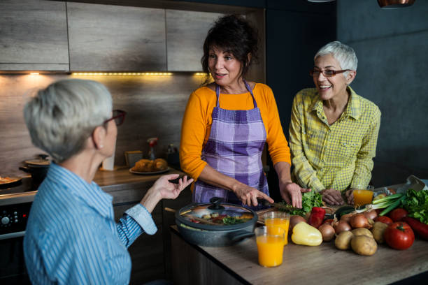 istock Senior women cooking together 1159588569