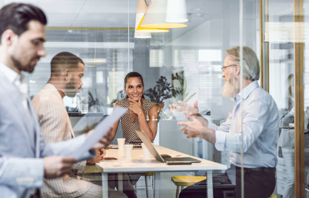 istock Business People Sitting in The Office, Discussing 1159589755