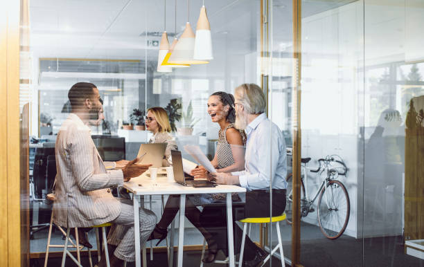 istock Business People Sitting in The Office, Discussing 1159589990