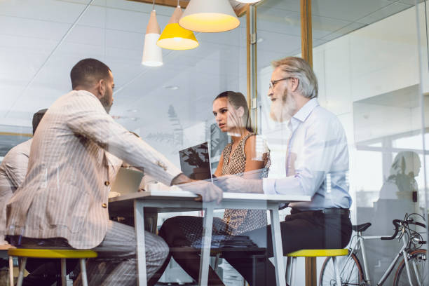 istock Business People Sitting in The Office, Discussing 1159590345