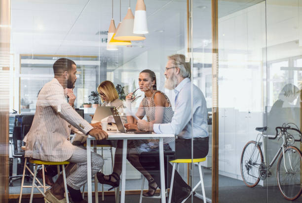 istock Business People Sitting in The Office, Discussing 1159590620
