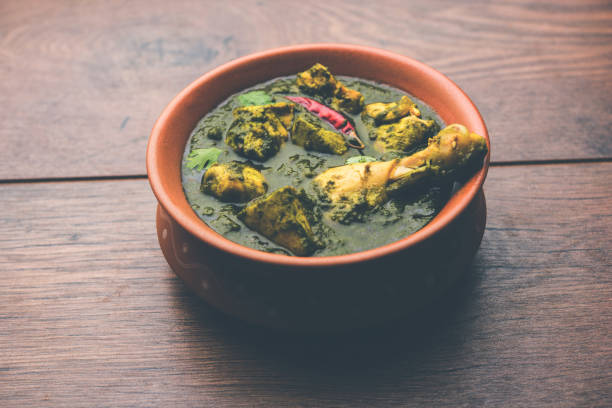 istock palak/spinach Chicken or Murg Saagwala served in a bowl with Naan and rice 1159590650