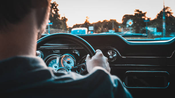 istock Driver in  a vintage car. Golden hour 1159591367
