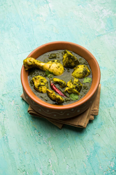istock palak/spinach Chicken or Murg Saagwala served in a bowl with Naan and rice 1159591407