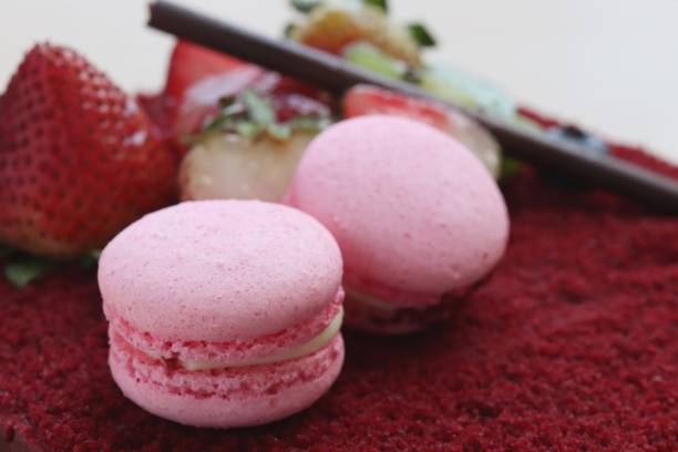 istock pink macaroon on top red valet cake 1159591612