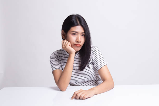 istock Asian girl is getting bore. 1159592704