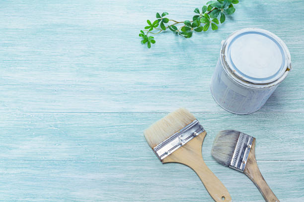 istock Paint and brush placed on a wooden board 1159593593
