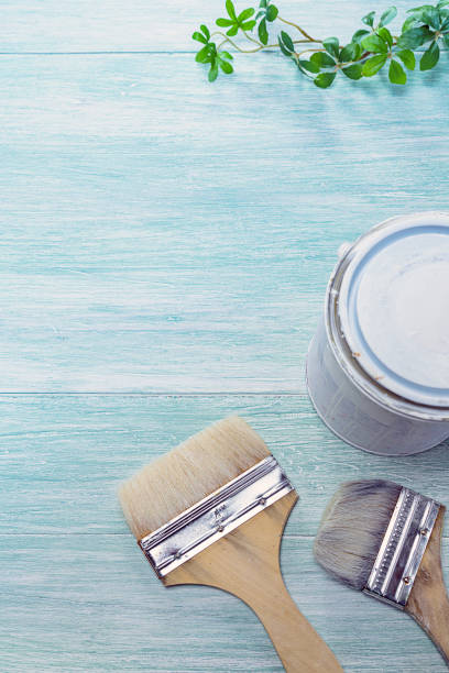istock Paint and brush placed on a wooden board 1159593646