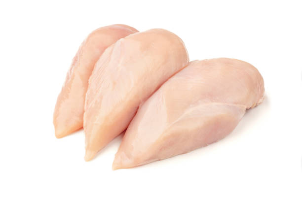 istock Raw chicken breast filets isolated on white background. 1159594729