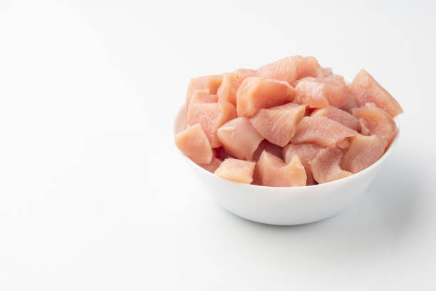 istock Raw chicken fillet chunks isolated on white 1159595373