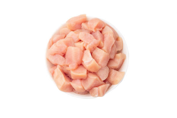 istock Raw chicken fillet chunks isolated on white 1159595407