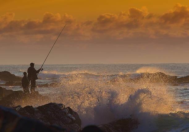 Pescatore all'alba - foto stock