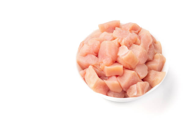 istock Raw chicken fillet chunks isolated on white 1159596380