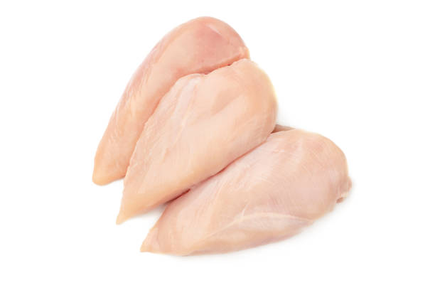 istock Raw chicken breast filets isolated on white background. 1159596770