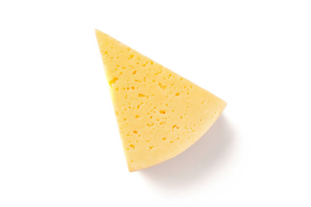 slice of gouda on a white background - gouda imagens e fotografias de stock