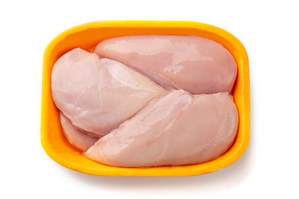 istock Raw chicken fillet package isolated on white background. 1159596918