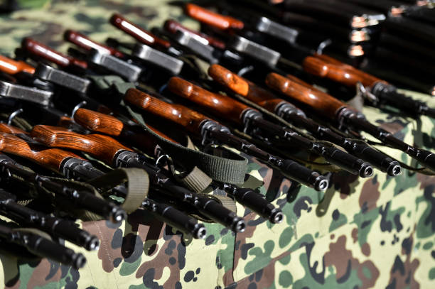 istock Assault rifles and round magazine loaders in a shooting range 1159601256