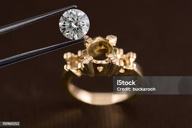 Photo Of A Diamond Above An Engagement Ring Stock Photo - Download Image Now - Arranging, Diamond - Gemstone, Setting