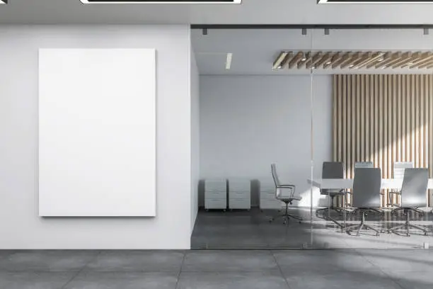 Modern meeting room interior with empty banner on wall and furniture. Mock up, 3D Rendering