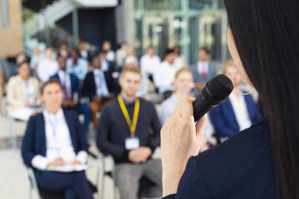 istock Young businesswoman doing speech in conference room 1159604464