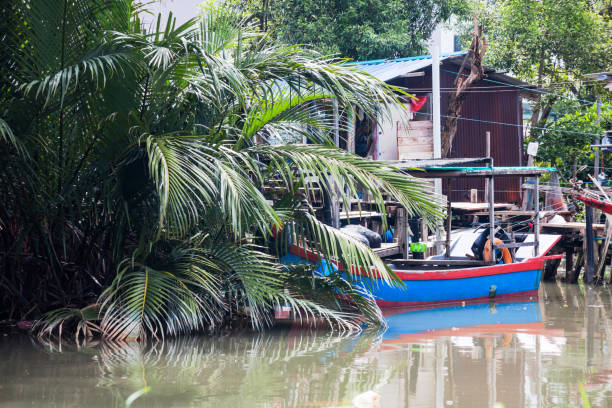 Wooden house by the river side view indicating poverty