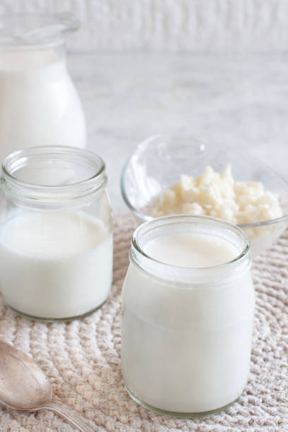 istock Fermented drink kefir in small bottles and kefir grains 1159604833