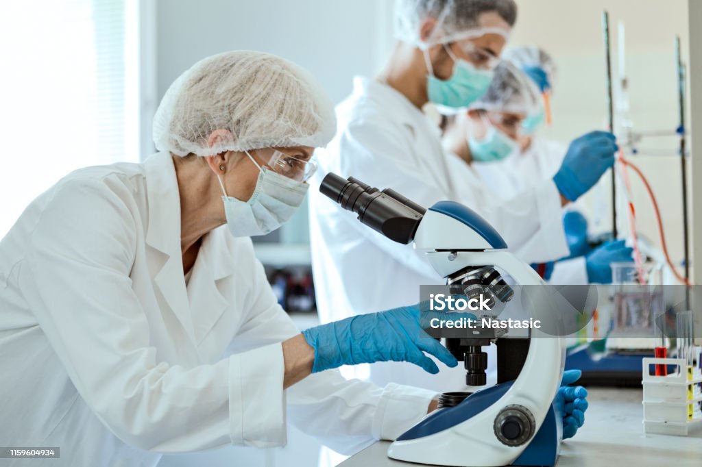 Lab Jobs Senior Laboratory Technician Working In Laboratory Looking Through ...