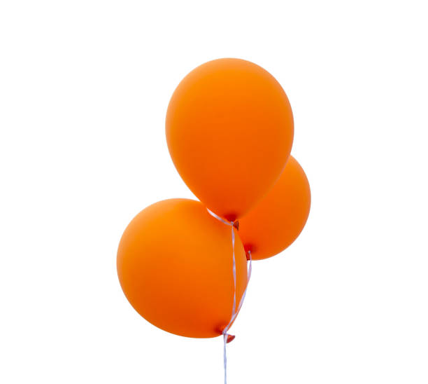 istock Bunch of orange balloons on a white background. Isolated 1159604946