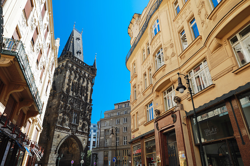 Prague, Czech Republic - June 27, 2019: View of Landmark architecture building call name Powder tower(Prasna brand) in Prague, Czech Republic in the centre city in sunny day on blue sky background.