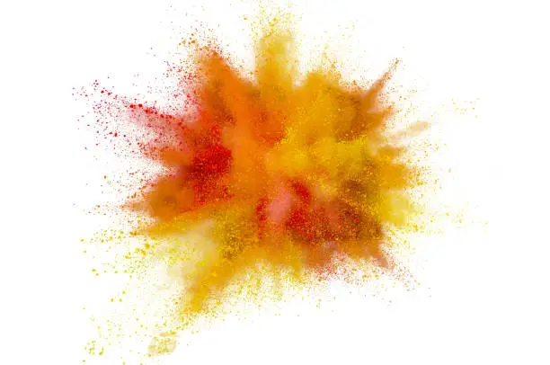 Photo of Colored powder explosion on white background. Abstract closeup dust on backdrop. Colorful explode. Paint holi