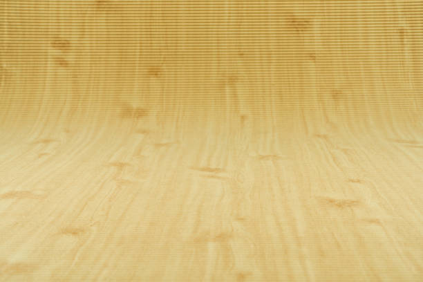 A close-up of a rustic wooden surface with visible grain, natural imperfections, and an aged, weathered look. The mix of light and dark wood tones creates an organic and textured aesthetic, making it ideal for use as a background for design, photography, or interior projects.