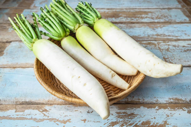 istock Fresh radish in a wooden basket 1159609715