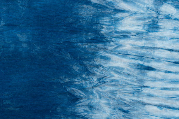 istock Pattern of blue tie batik dye on cotton cloth, Dyed indigo fabric background and textured 1159611633