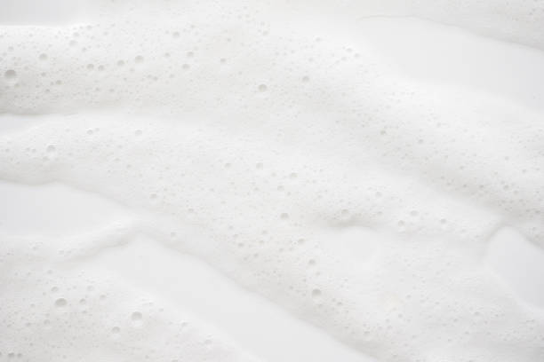 istock Abstract background white soapy foam texture. Shampoo foam with bubbles 1159612158